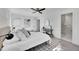 A spacious bedroom with a ceiling fan, closet, and adjoining bathroom at 3798 S Wabash St, Denver, CO 80237