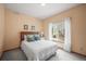 Cozy bedroom with a comfortable bed, soft lighting, and a window view at 6475 Umber Cir, Arvada, CO 80007