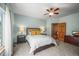 Lovely bedroom with a door to the bathroom and a view at 6475 Umber Cir, Arvada, CO 80007