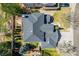 Aerial view showcases the home's roof, yard, landscaping, and driveway at 2462 W Peakview Ct, Littleton, CO 80120