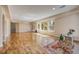 Bright basement area with natural light, hardwood floors, and walkout access to the outdoors at 2462 W Peakview Ct, Littleton, CO 80120