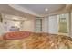 Spacious basement featuring built-in shelving and easy access to the upper level through the stairs at 2462 W Peakview Ct, Littleton, CO 80120