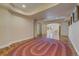 Finished basement area featuring hardwood floors and a large oval rug for added comfort at 2462 W Peakview Ct, Littleton, CO 80120
