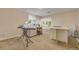 Bright, carpeted room with multiple windows and sewing table setup at 2462 W Peakview Ct, Littleton, CO 80120