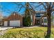 Beautiful exterior featuring a lush green lawn and mature tree, offering shade and curb appeal at 2462 W Peakview Ct, Littleton, CO 80120