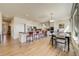 Spacious eat-in kitchen with a large island, stainless appliances, and hardwood floors at 2462 W Peakview Ct, Littleton, CO 80120