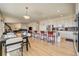 Open-concept living area with an island, stainless steel appliances, and access to the Gathering room at 2462 W Peakview Ct, Littleton, CO 80120