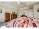 Spacious main bedroom features a ceiling fan, ensuite bathroom, and dual dressers at 2462 W Peakview Ct, Littleton, CO 80120