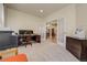 Bright office space with French doors leading to the dining room, hardwood floors, and natural light at 2462 W Peakview Ct, Littleton, CO 80120