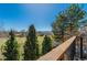 Scenic overlook featuring a wooden fence and trees at 2462 W Peakview Ct, Littleton, CO 80120
