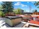 Backyard with a hot tub and retaining wall, creating a private and relaxing outdoor oasis at 426 Jupiter Dr, Lone Tree, CO 80124