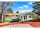 Expansive backyard with a hot tub, lawn, and patio area, ideal for relaxation and outdoor activities at 426 Jupiter Dr, Lone Tree, CO 80124