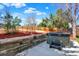 Backyard with a hot tub, providing a relaxing retreat with privacy and tiered landscaping features at 426 Jupiter Dr, Lone Tree, CO 80124
