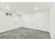 Finished basement area with neutral carpet, recessed lighting, and windows at 426 Jupiter Dr, Lone Tree, CO 80124