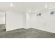 Spacious basement area with neutral carpet, recessed lighting, and a large doorway at 426 Jupiter Dr, Lone Tree, CO 80124