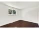 Bright bedroom featuring hardwood floors, a window, and fresh paint at 426 Jupiter Dr, Lone Tree, CO 80124