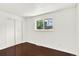 This bedroom features hardwood floors and a closet for storage at 426 Jupiter Dr, Lone Tree, CO 80124
