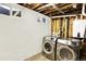 The laundry room features a new washer and dryer and painted walls at 426 Jupiter Dr, Lone Tree, CO 80124