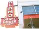 Eye-catching Alamo Draft House Cinema sign on the corner of a building at 1344 N Knox Ct, Denver, CO 80204
