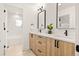 Modern bathroom with dual sinks, quartz countertops, and stylish fixtures at 1344 N Knox Ct, Denver, CO 80204