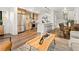 Stylish kitchen featuring stainless steel appliances, modern lighting, and bar seating at 1344 N Knox Ct, Denver, CO 80204