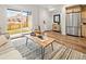 Bright living room with hardwood floors and access to a patio at 1344 N Knox Ct, Denver, CO 80204