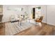 Cozy living room with hardwood floors, modern furnishings, and a sliding glass door at 1344 N Knox Ct, Denver, CO 80204