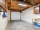 One car garage with overhead door and built in shelving at 2537 Chase St, Edgewater, CO 80214