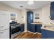Updated kitchen with stainless steel appliances and white refrigerator at 2537 Chase St, Edgewater, CO 80214