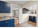 Modern kitchen with blue cabinets and granite countertops at 2537 Chase St, Edgewater, CO 80214