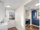 Laundry area with stackable washer and dryer, and backyard access at 2537 Chase St, Edgewater, CO 80214