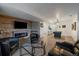 Basement entertainment area with fireplace, tv, kitchenette, and a billiards table for recreation at 7895 S Zante Ct, Aurora, CO 80016