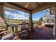 Inviting covered patio featuring wood flooring, and views of the community golf course at 7895 S Zante Ct, Aurora, CO 80016