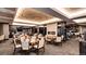 Large dining area with ample seating, wet bar and fireplace for an upscale experience at 7895 S Zante Ct, Aurora, CO 80016
