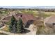 This home features an attached two-car garage, mature landscaping, and is situated near a golf course at 7895 S Zante Ct, Aurora, CO 80016