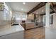 Modern kitchen with stainless steel appliances, bright countertop, and hardwood floors at 7895 S Zante Ct, Aurora, CO 80016