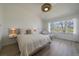 Bright bedroom with accent lighting, large window, and hardwood floors at 7895 S Zante Ct, Aurora, CO 80016