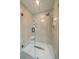 Modern shower with glass enclosure and tile surround at 7895 S Zante Ct, Aurora, CO 80016