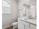 Modern bathroom features a white sink, white cabinets, and brushed nickel fixtures at 14101 Deertrack Ln, Parker, CO 80134