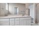 Beautiful bathroom features dual sinks, quartz countertops and modern cabinetry at 14101 Deertrack Ln, Parker, CO 80134