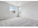Bright and airy bedroom with neutral carpeting, large windows, and ample natural light at 14101 Deertrack Ln, Parker, CO 80134