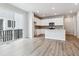 Modern kitchen with white cabinets, stainless steel appliances, and an island sink at 14101 Deertrack Ln, Parker, CO 80134