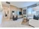 Cozy living room with modern furniture, a statement wall, and plenty of natural light at 14101 Deertrack Ln, Parker, CO 80134