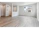 Bright living room features light wood floors, neutral walls and large windows for lots of natural light at 14101 Deertrack Ln, Parker, CO 80134