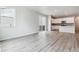 Bright living room features light wood floors and large windows and sliding glass doors at 14101 Deertrack Ln, Parker, CO 80134