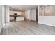 Open floor plan features the kitchen and living room with hard surface floors and neutral walls at 14101 Deertrack Ln, Parker, CO 80134