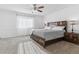 Bright bedroom with large window and plush carpeting at 22382 E Mercer Pl, Aurora, CO 80018