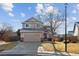 Two-story house with attached garage and landscaped yard at 22382 E Mercer Pl, Aurora, CO 80018