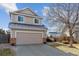 Two-story house with attached garage and neat lawn at 22382 E Mercer Pl, Aurora, CO 80018