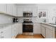 Clean and bright kitchen with stainless steel appliances at 22382 E Mercer Pl, Aurora, CO 80018